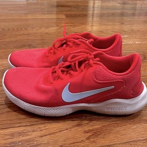 Pink / Coral Nike Flex tennis shoes